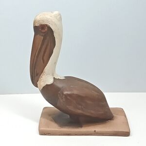 Vintage hand painted ceramic pelican figurine.